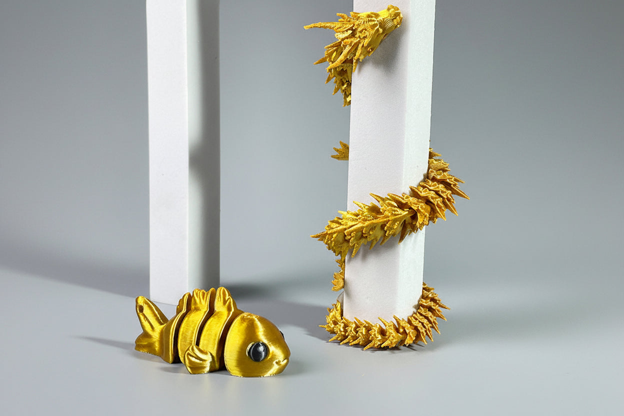 Gold fish-like creature with dragon features on a white background